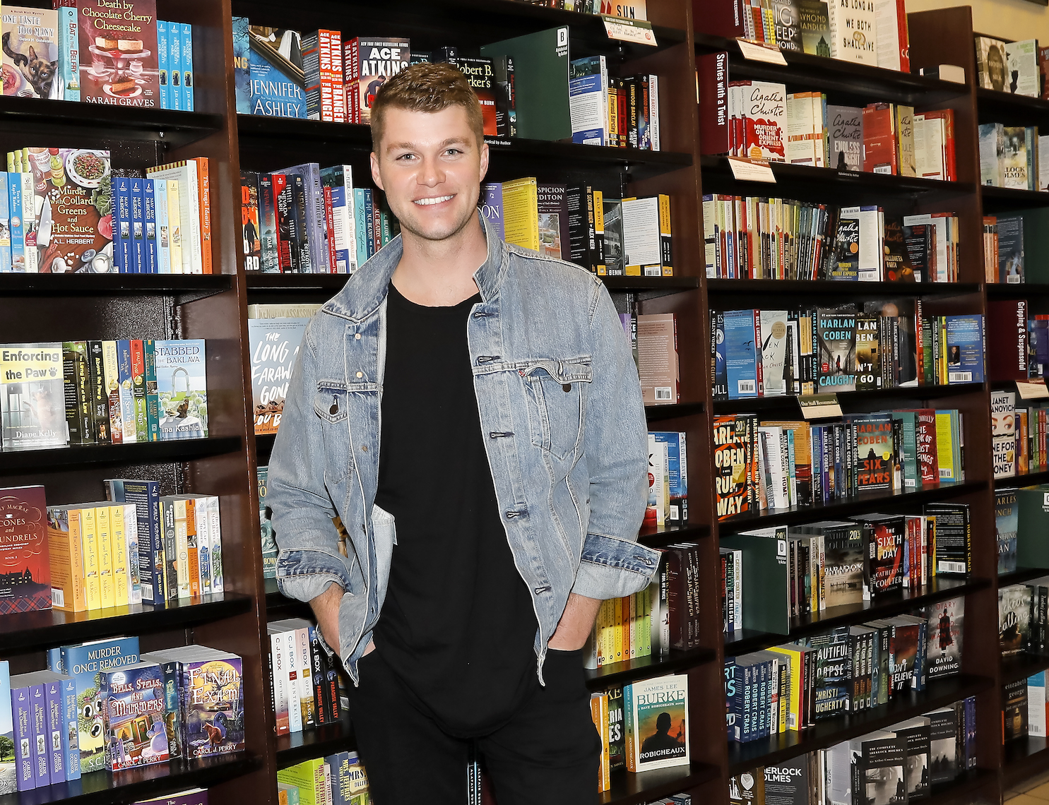 'Little People, Big World' star Jeremy Roloff smiling against a bookshelf