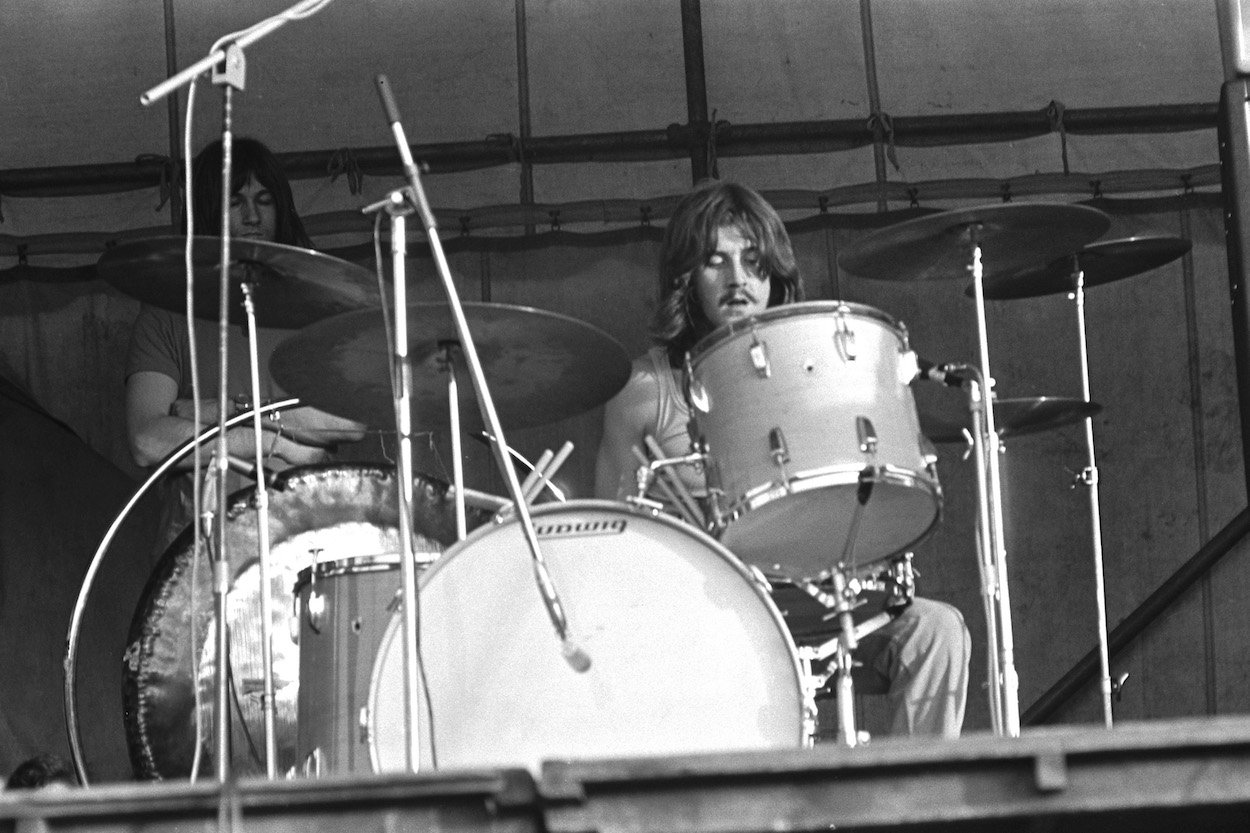 John Bonham sits behind his drum kit during a Led Zeppelin performance at the 1969 Bath Festival.