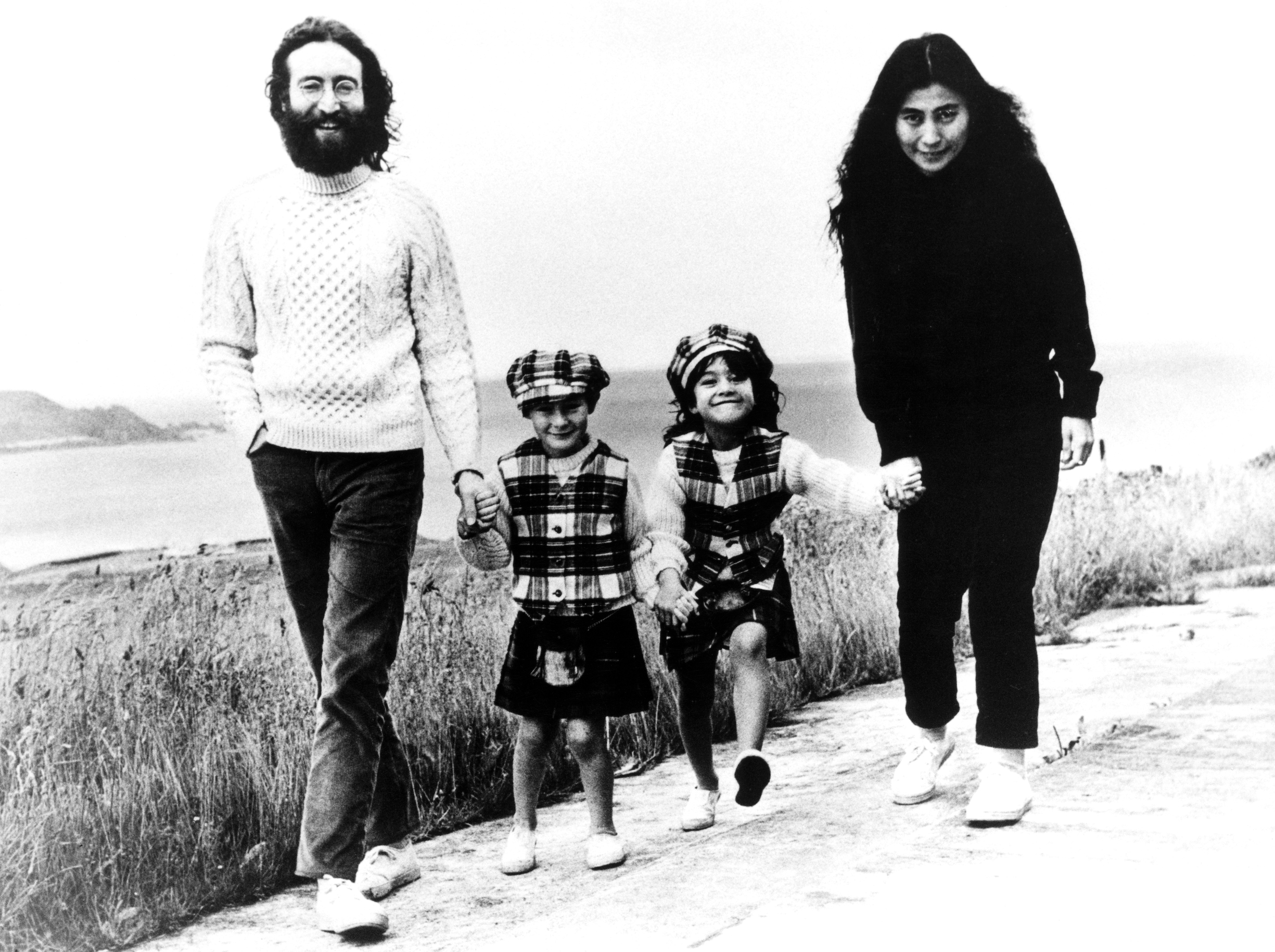 John Lennon and Yoko Ono with their children from previous marriages Julian Lennon, 6, and daughter Kyoko, 5, pictured taking a walk during their Scottish Holiday