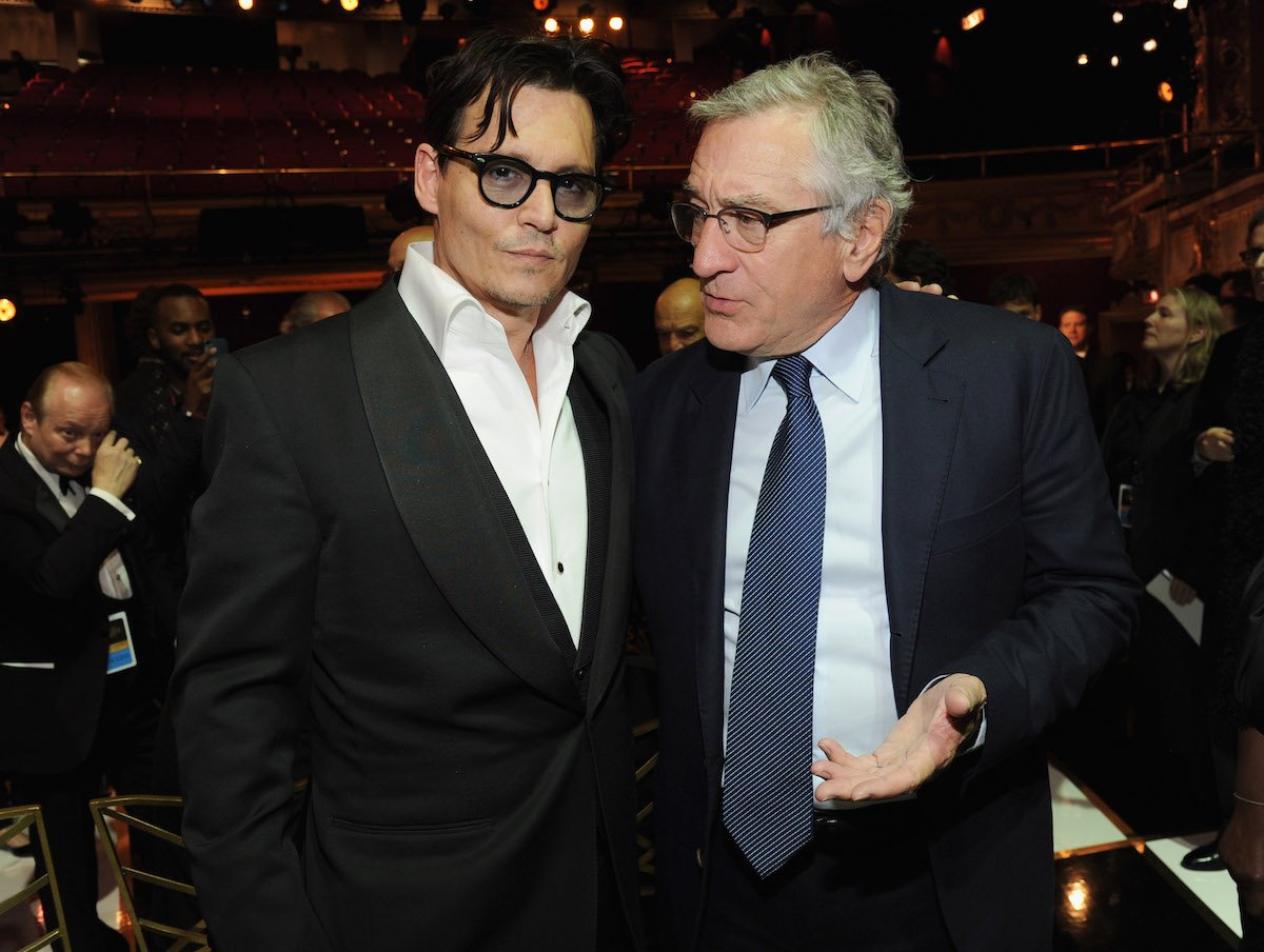 Johnny Depp puts his arm around Robert De Niro