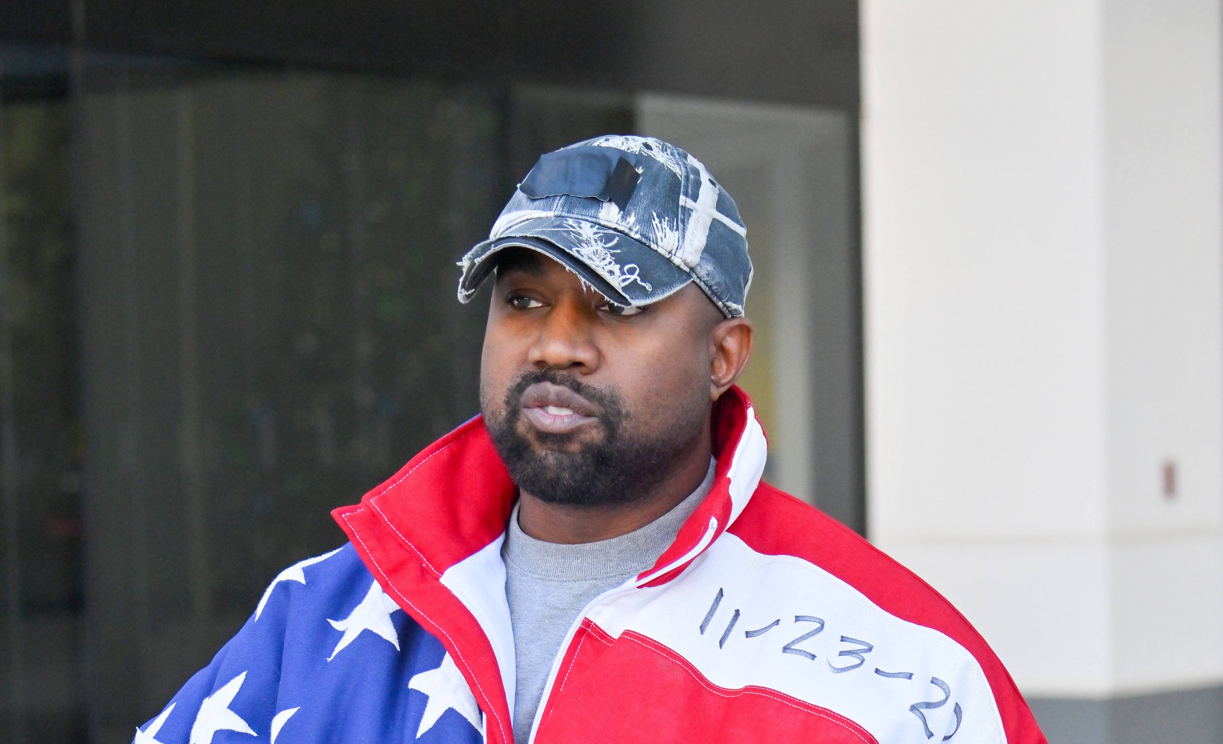 Kanye West, who recently married Bianca Censori of Australia, wearing an American flag jacket