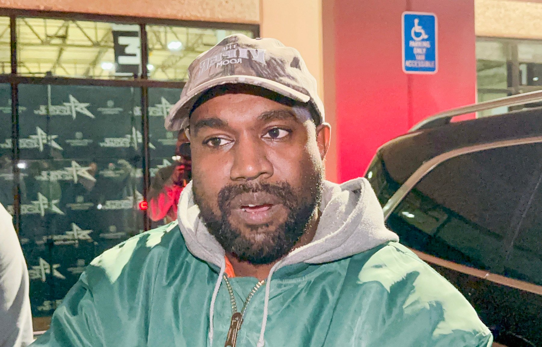 Kanye West, who was spotted leaving church in early 2023, wearing a green sweater