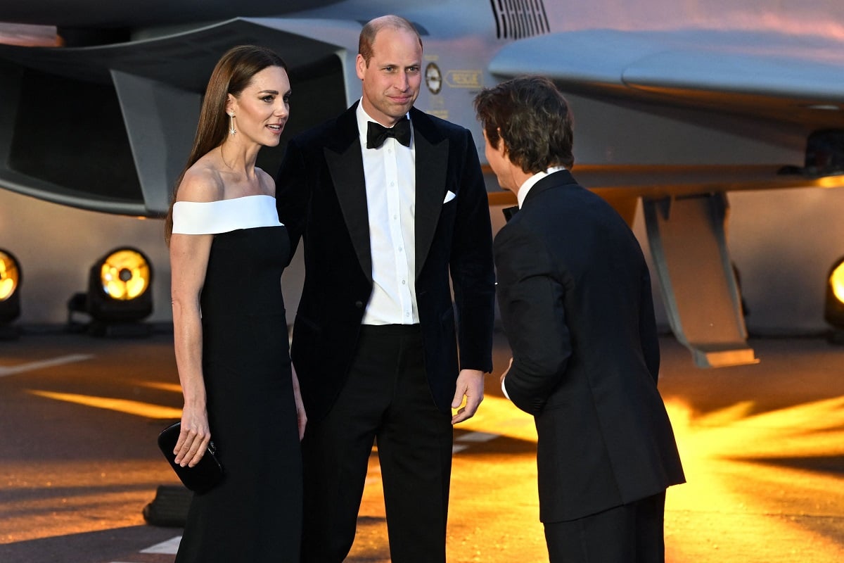 Kate Middleton and Prince William speak with Tom Cruise as they arrive for the U.K. premiere of 'Top Gun Maverick'