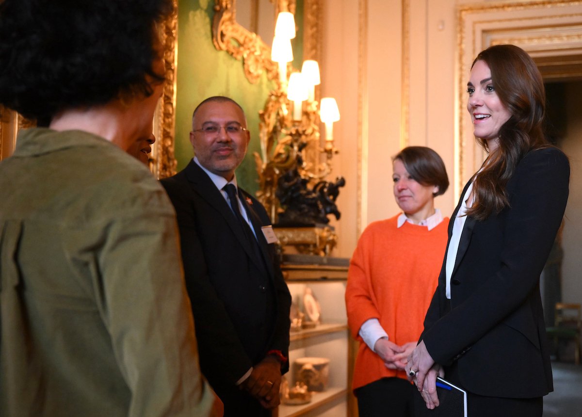 Kate Middleton, who held the first meeting of an early years advisory group, speaks with experts at Windsor Castle