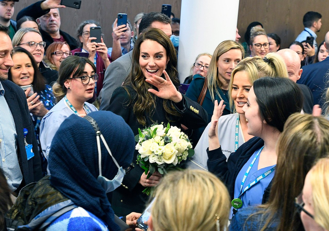 Kate Middleton, Princess of Wales, visits a hospital in 2023. A body language expert noted a scenario where Kate is "more confident than Prince William."