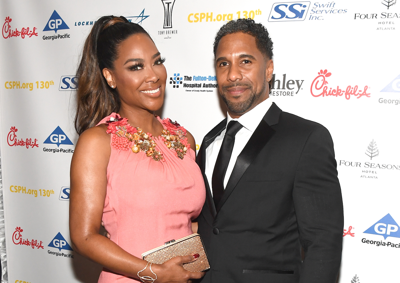 Kenya Moore and Marc Daly smile for photo