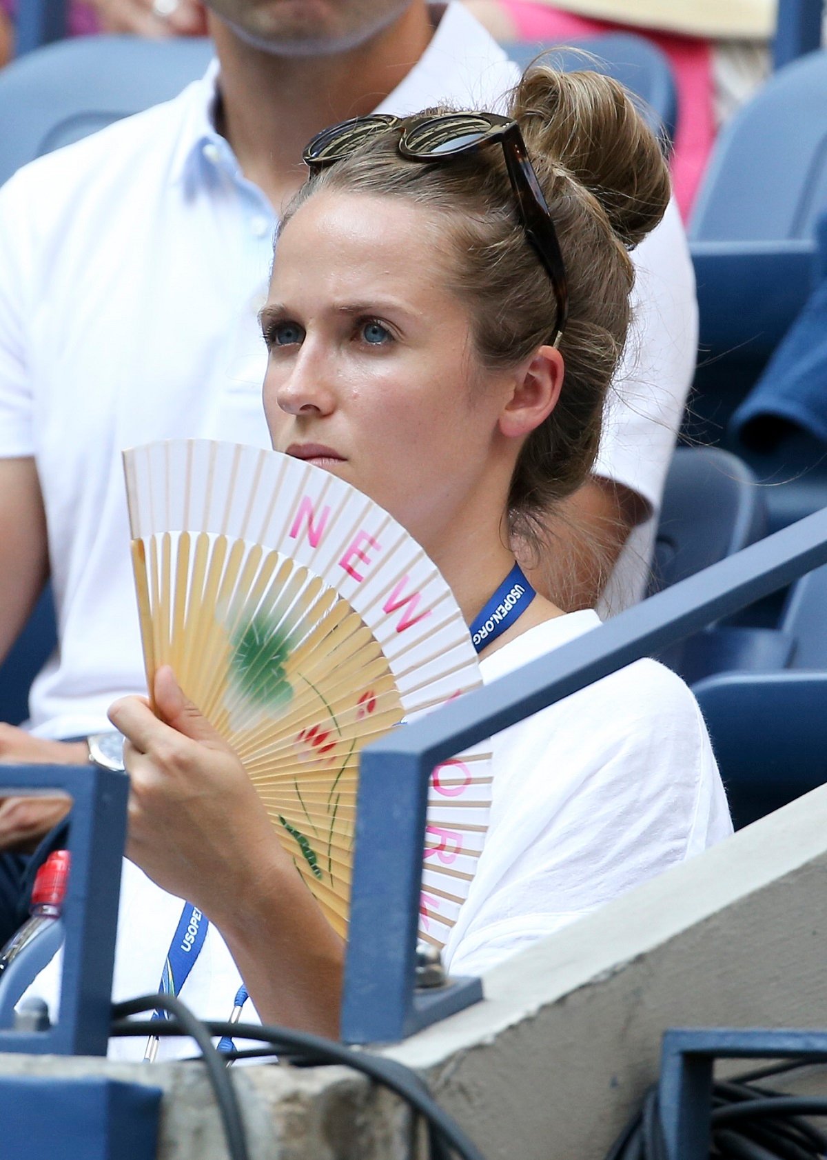 Kim Murray, wife of Andy Murray holds fan to her face during day 3 of the U.S. Open