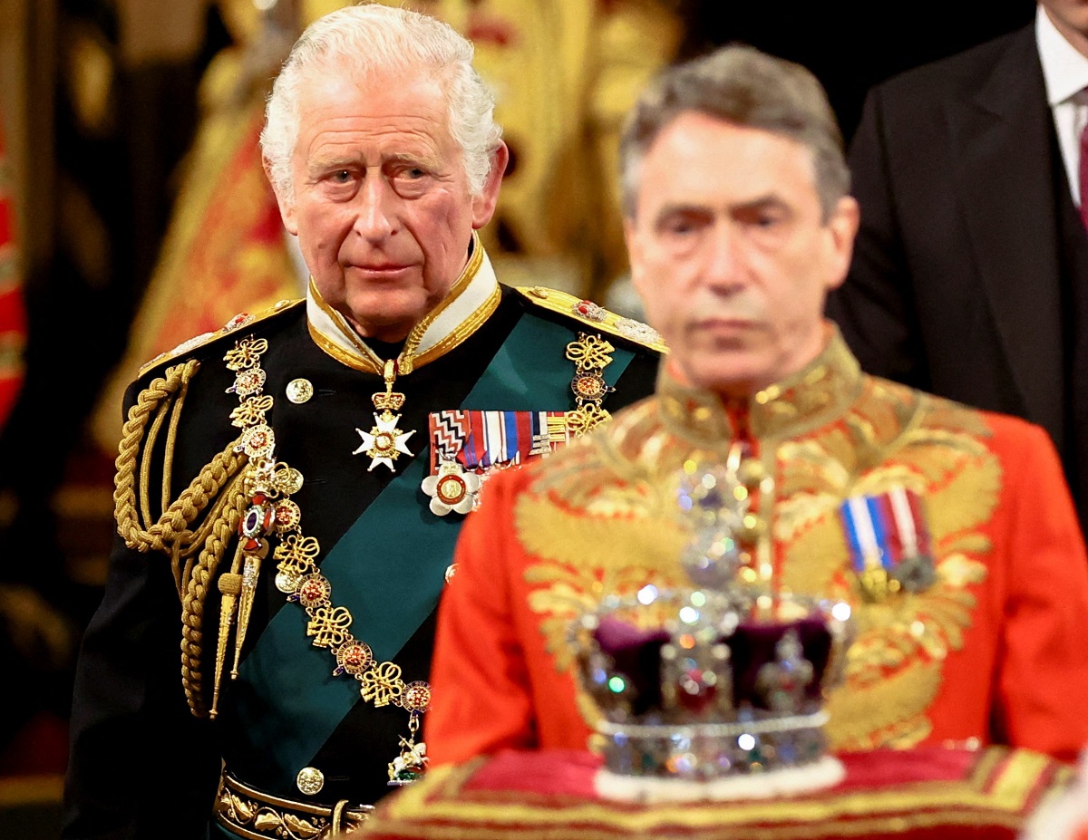 King Charles III proceeds behind the Imperial State Crown through the Royal Gallery during the State Opening of Parliament