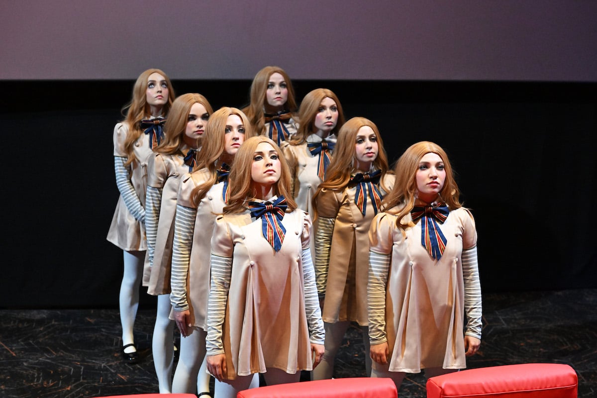 Half a dozen people dressed as M3GAN appear at an event promoting the film.