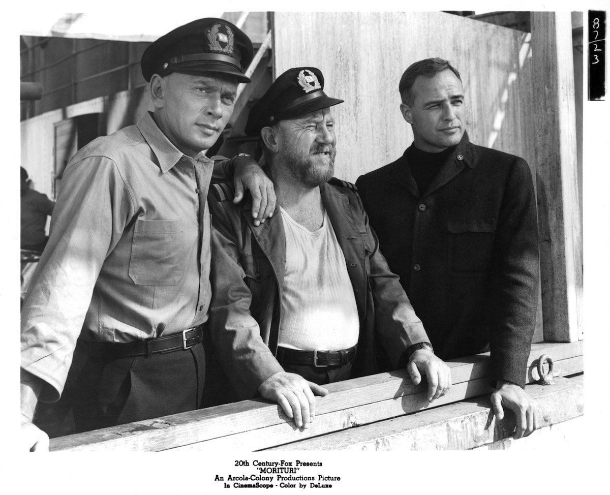 Actors Yul Brynner, Max Haufler, and Marlon Brando filming Morituri in 1965