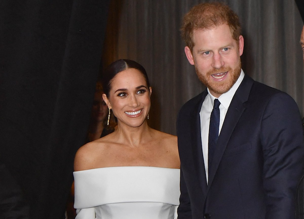 Meghan Markle and Prince Harry, who are 'winning' despite post-'Spare' popularity dip, look on