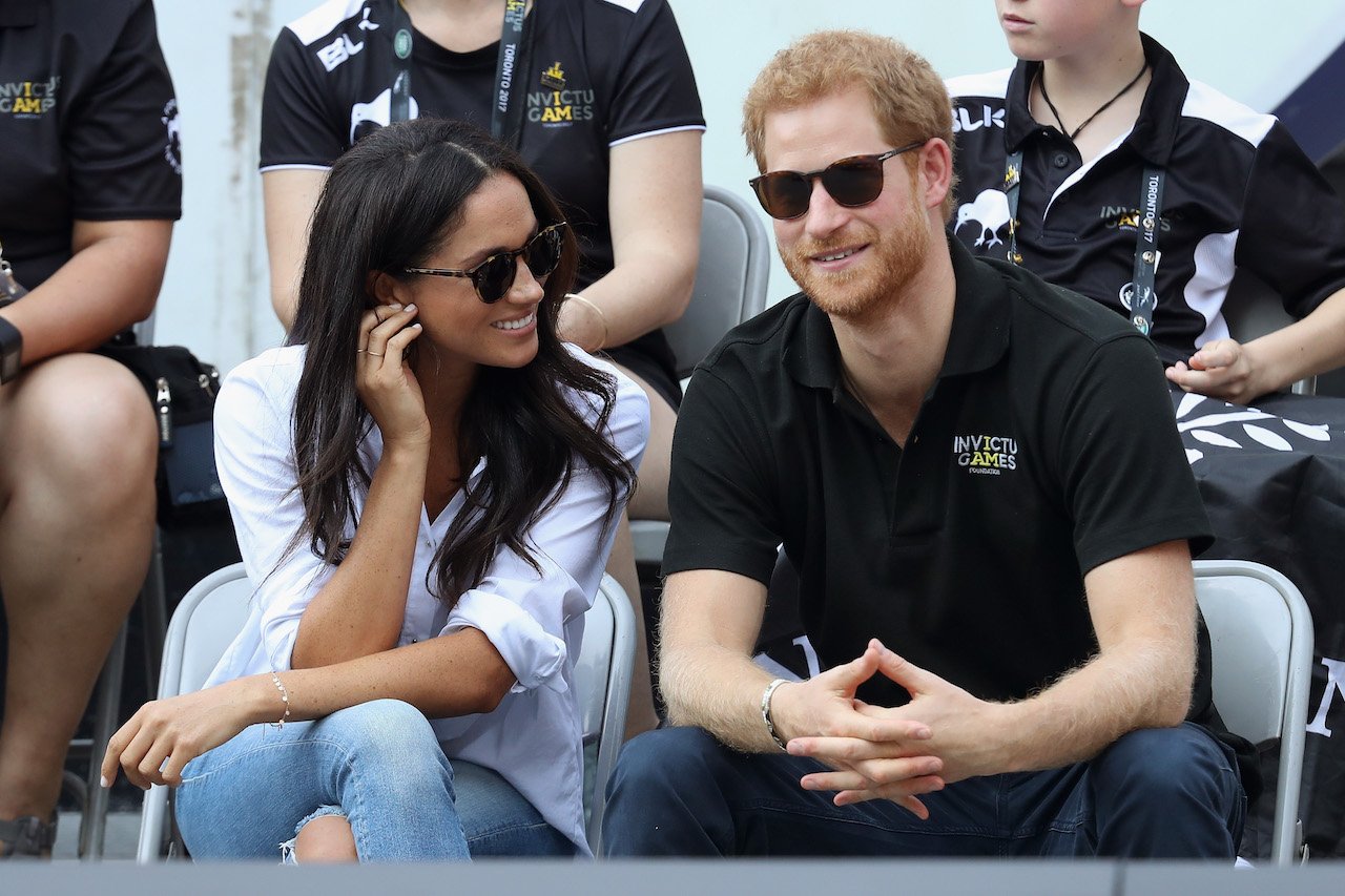 Meghan Markle and Prince Harry pictured at the 2017 Invictus Games. A body language expert explained how Meghan was in a "really difficult position" while trying to fit in with the royal family.