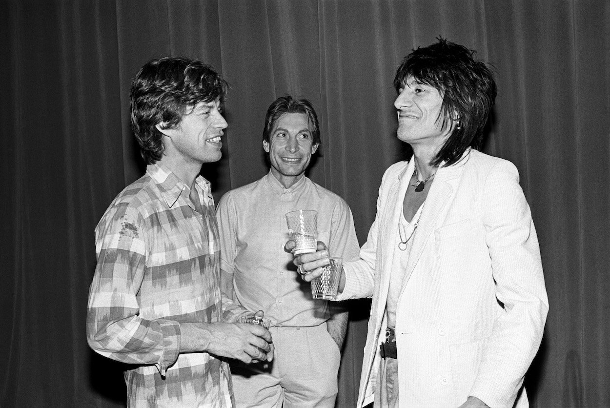 Rolling Stones members Mick Jagger (from left), Charlie Watts, and Ronnie Wood attend a party in New York City in 1980.