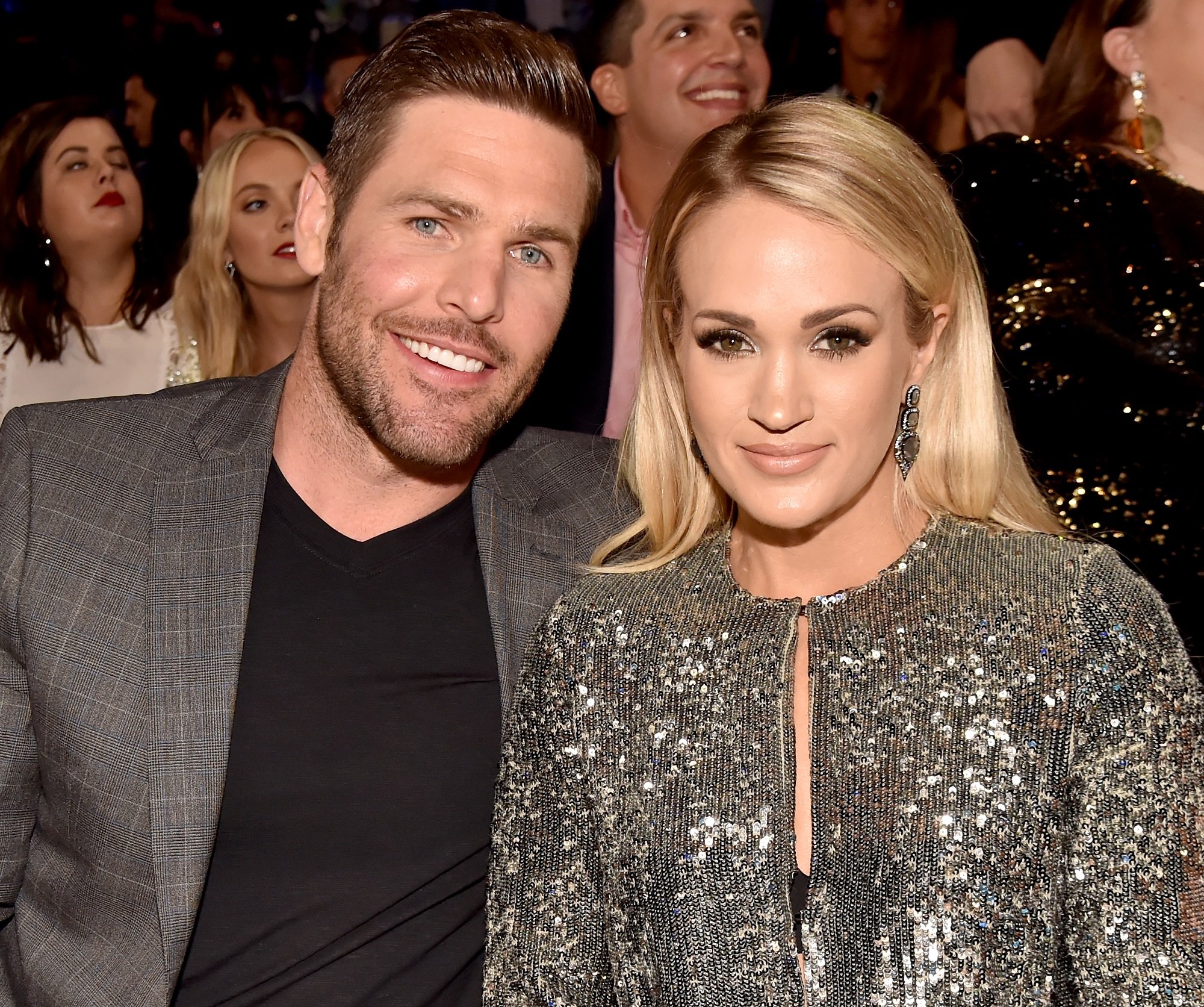 Mike Fisher and Carrie Underwood smile at the camera