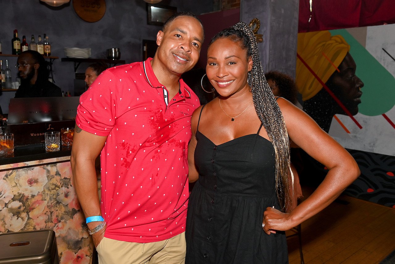 Mike Hill and Cynthia Bailey pose together at event