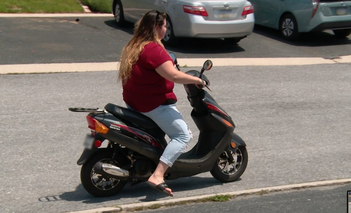 Ashley Smith's friend, Natalie, riding a moped on '90 Day Fiancé' Season 6 on TLC.
