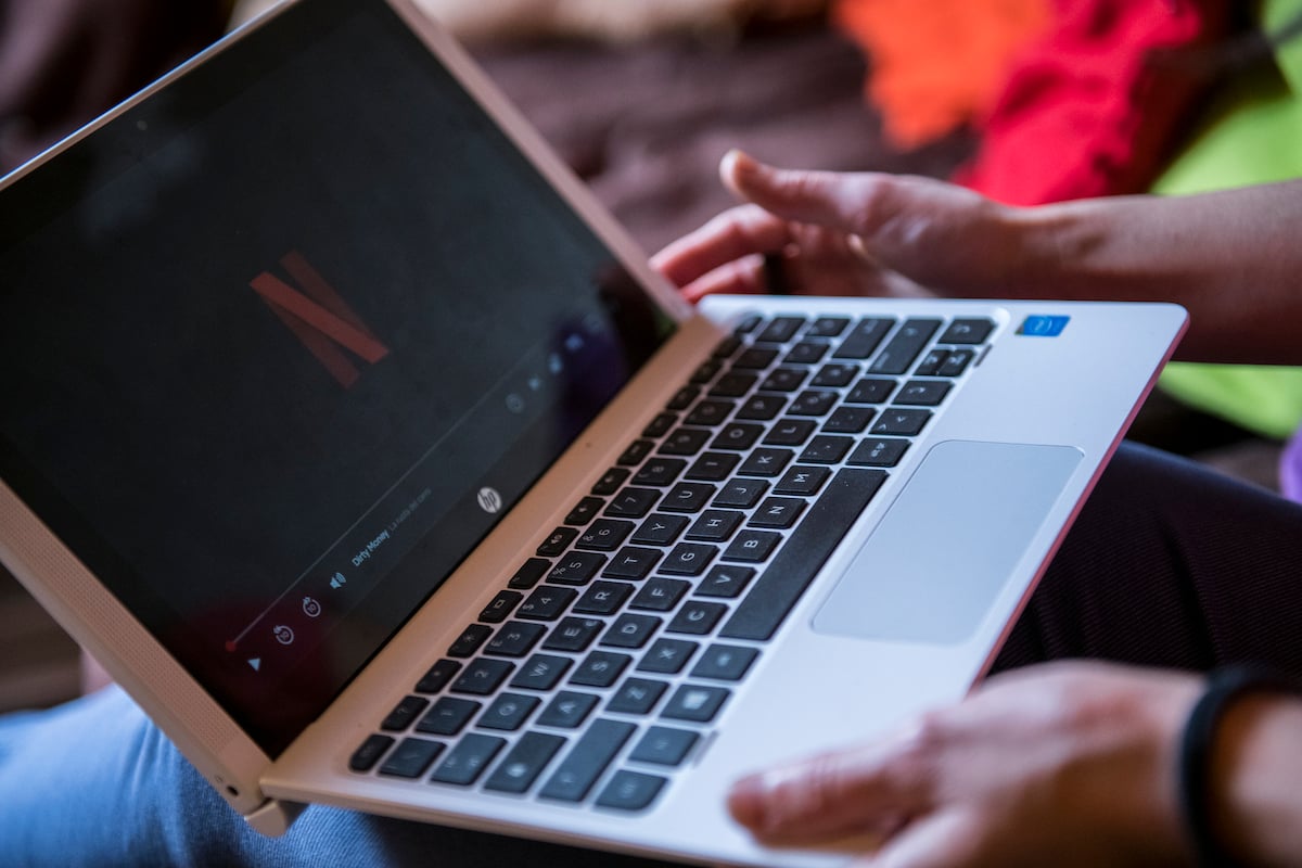 A Netflix user watches a on a laptop