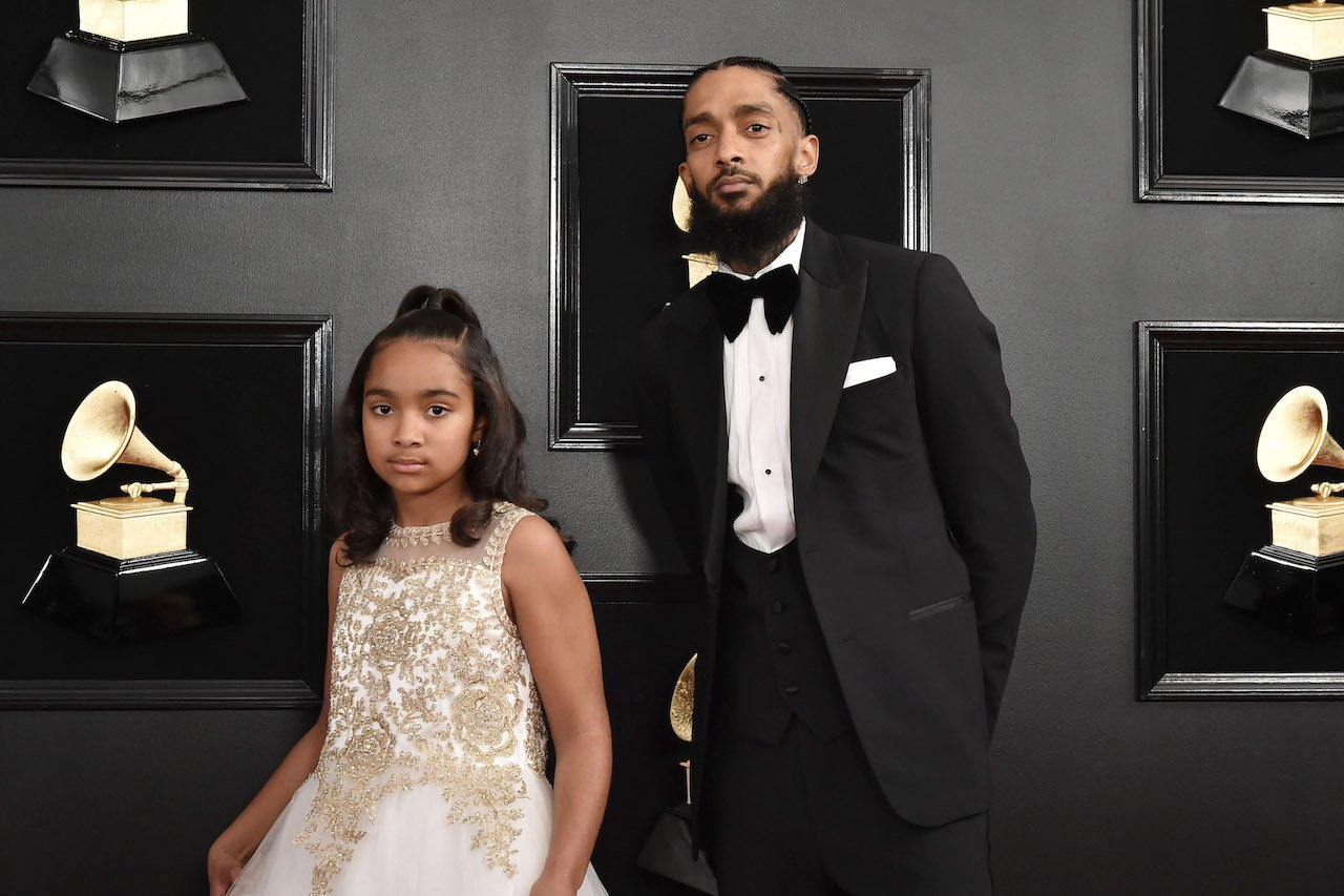 Nipsey Hussle with his daughter Emani
