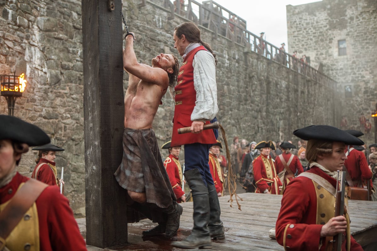 Outlander stars Sam Heughan and Tobias Menzies in an image from season 1