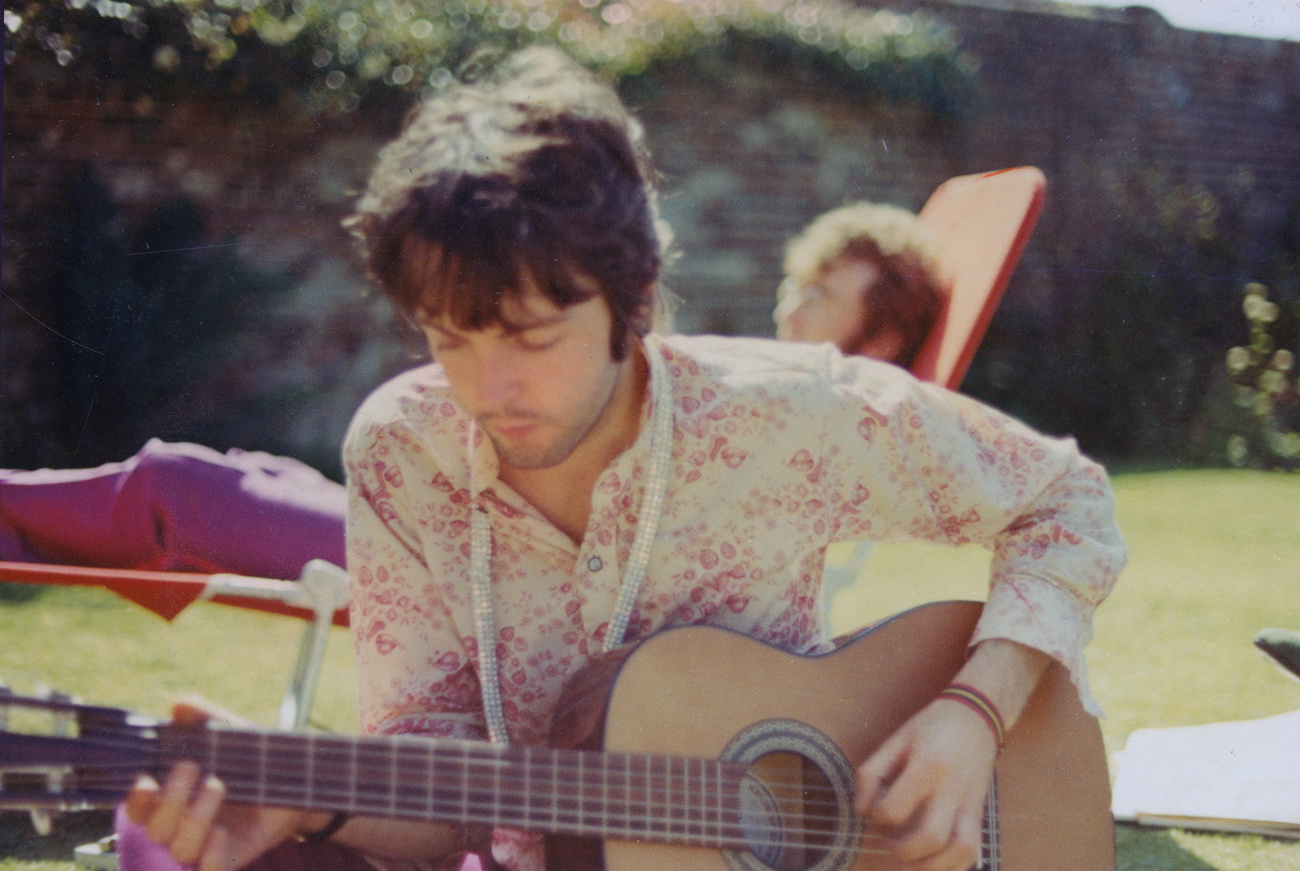 Paul McCartney and John Lennon in the backyard in 1967.