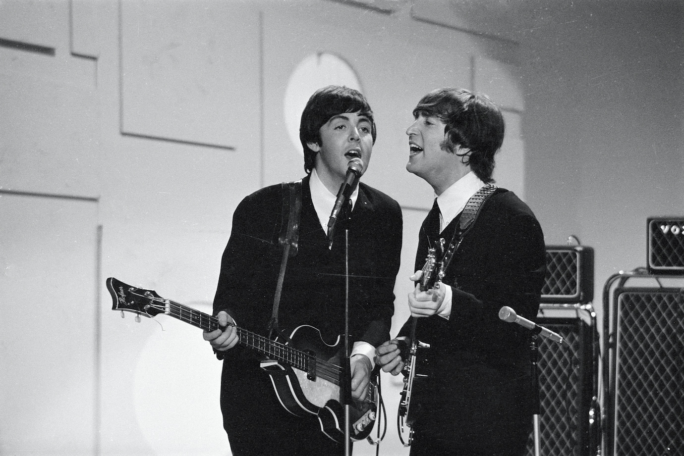 Paul McCartney and John Lennon play with The Beatles on The Ed Sullivan Show in 1965