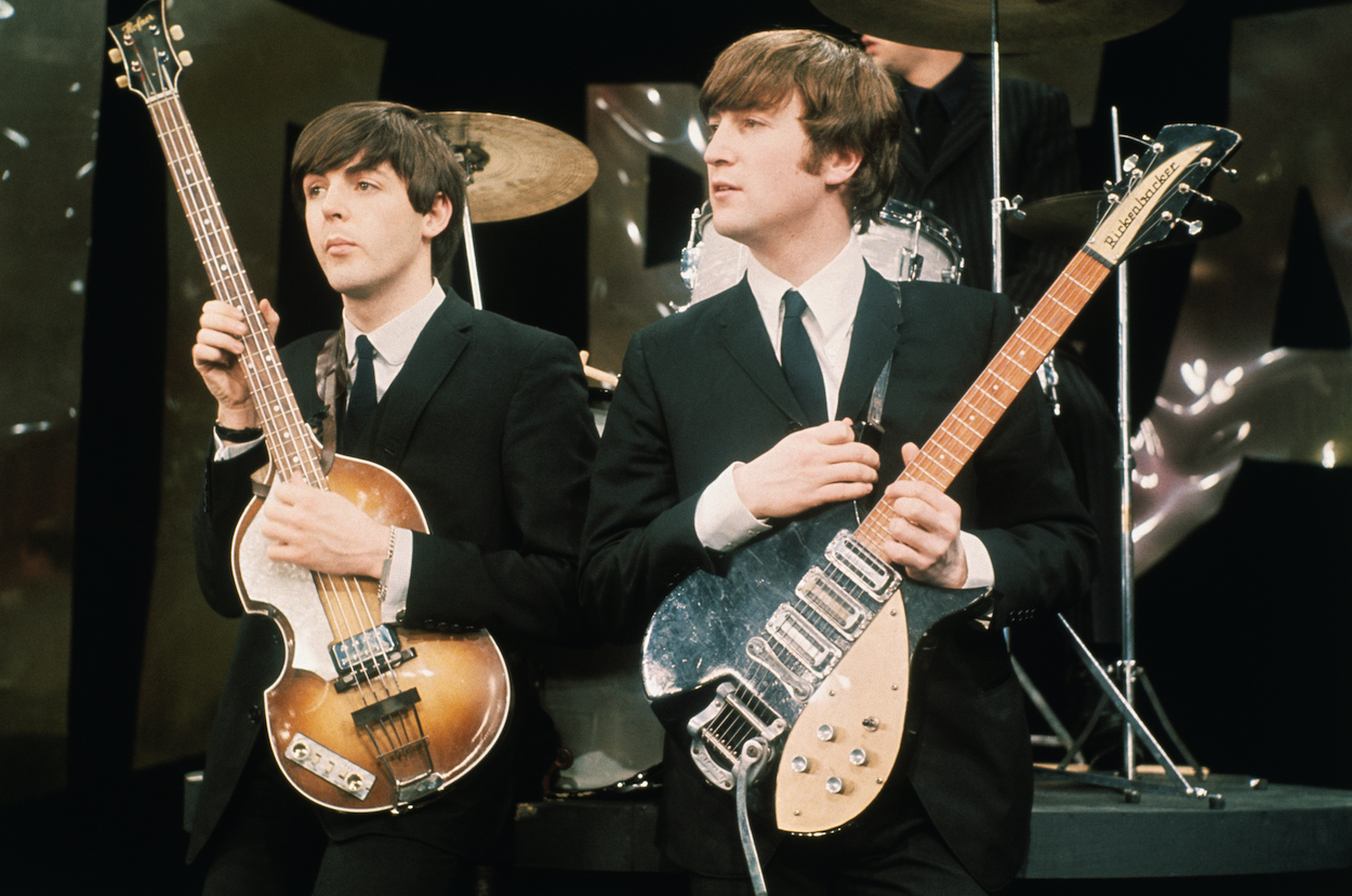 Paul McCartney (left) and John Lennon during The Beatles' appearance on 'The Ed Sullivan Show' in 1964.
