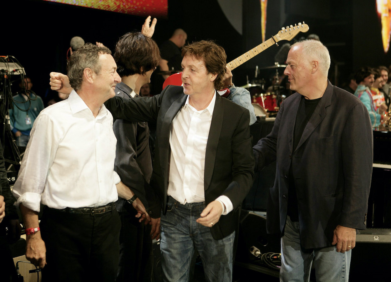 Paul McCartney (center) stands between Pink Floyd drummer Nick Mason (left) and guitarist David Gilmour in 2005