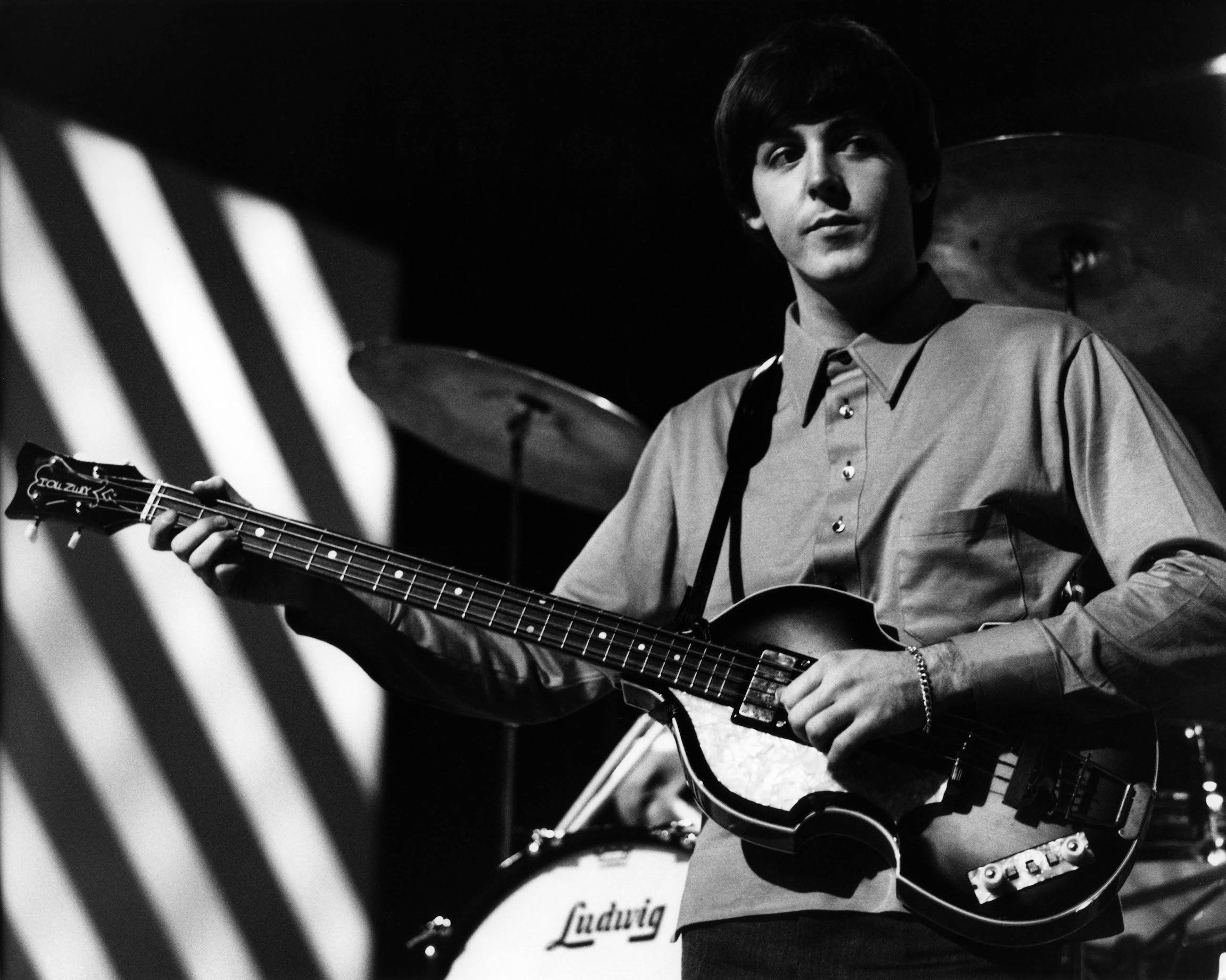 Paul McCartney plays his bass with The Beatles during rehearsals for 'Thank Your Lucky Stars' on ABC in 1964
