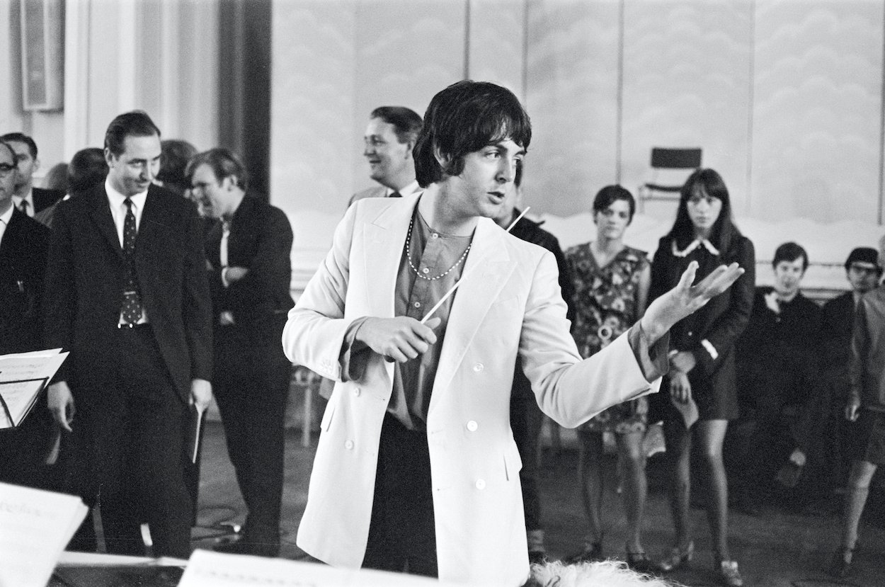 Beatles bassist Paul McCartney conducts the Black Dyke Mills Band during a June 1968 recording session.