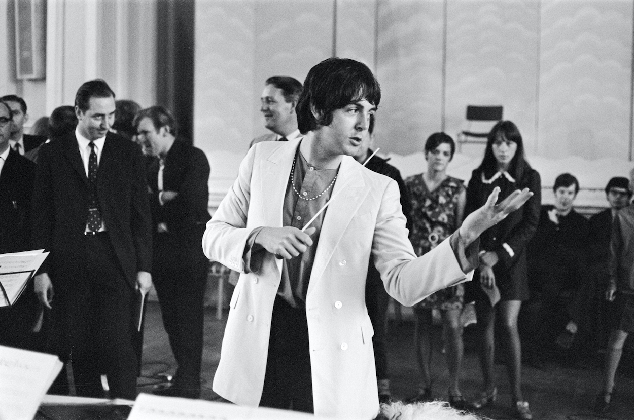 Beatles bassist Paul McCartney conducts the Black Dyke Mills Band during a June 1968 recording session.