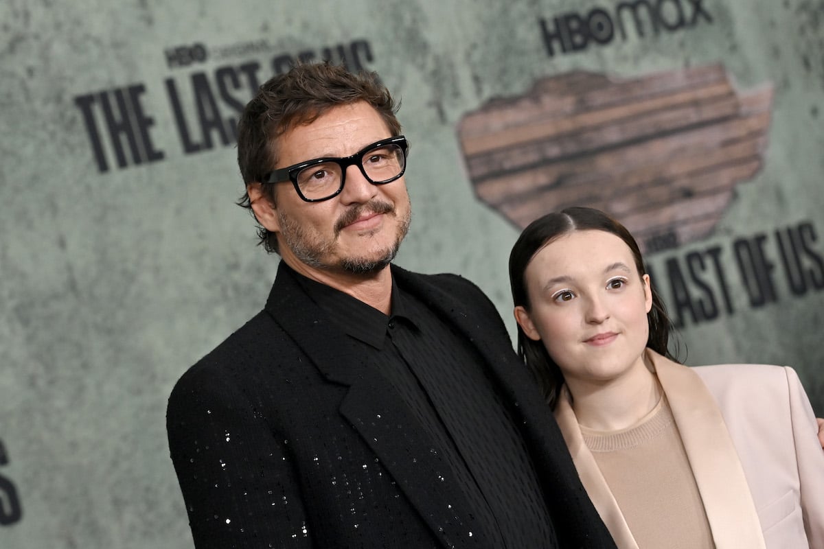 Pedro Pascal and Bella Ramsey pose for photos in front of "The Last of Us" backdrop