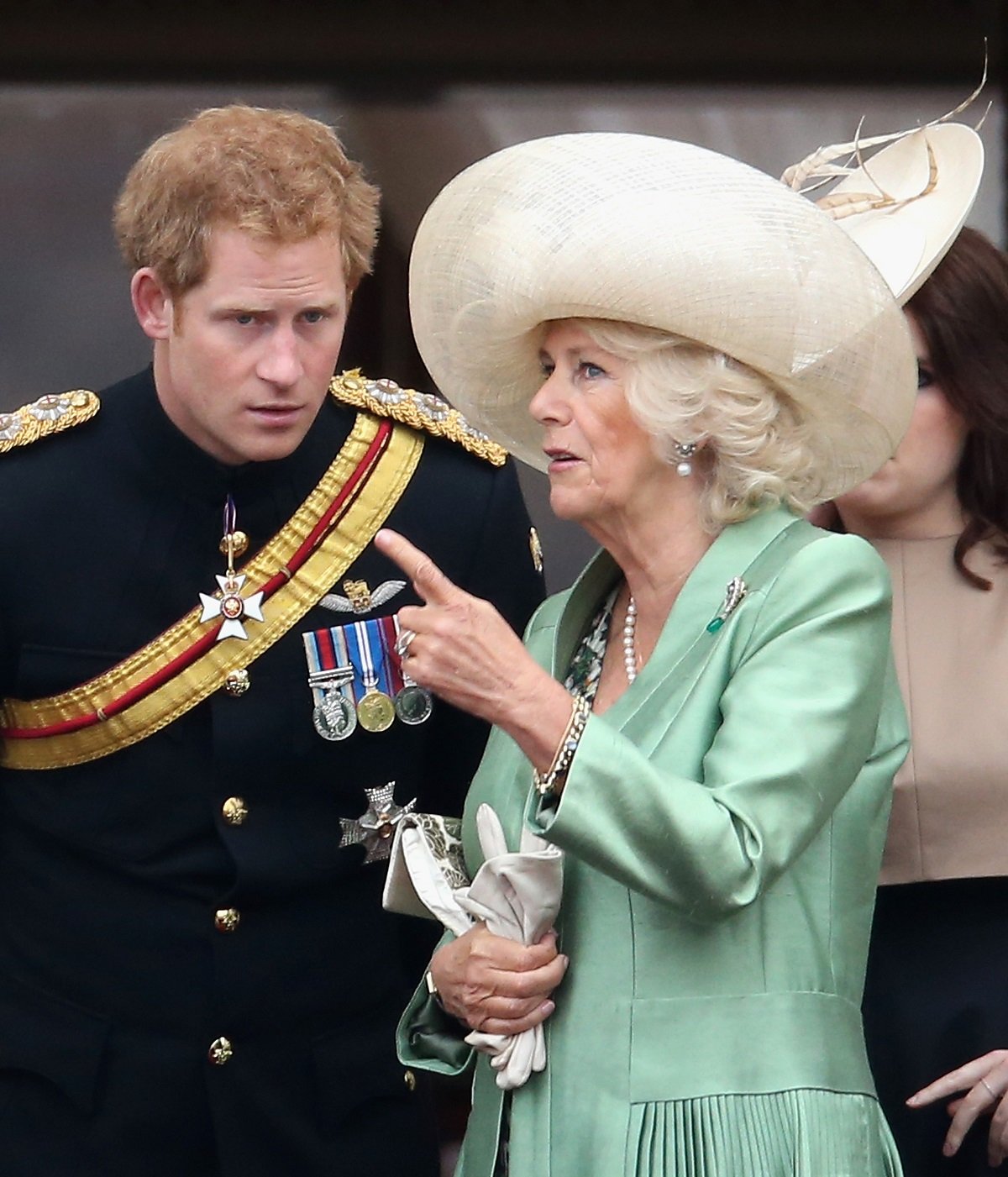 Prince Harry and Camilla Parker Bowles talking on the balcony of Buckingham Palace during the Trooping the Colour