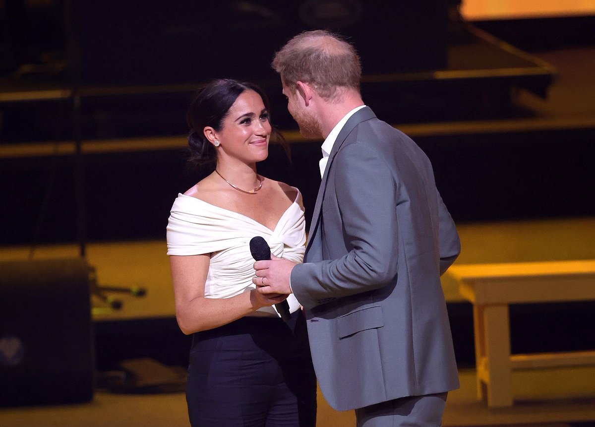 Prince Harry meeting Meghan Markle onstage during the Invictus Games The Hague opening ceremony
