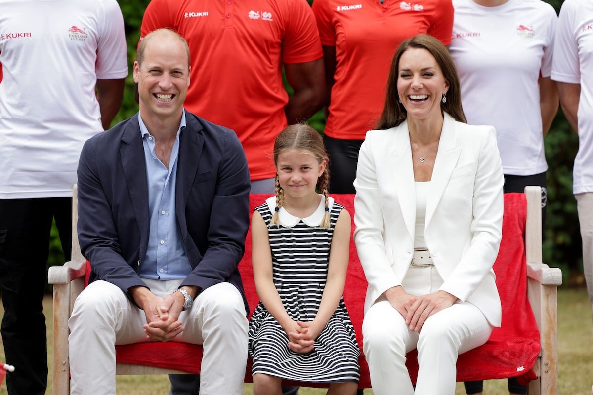 Prince William and Kate Middleton, who wrote a thank you note on behalf of Princess Charlotte, sit on either side of Princess Charlotte