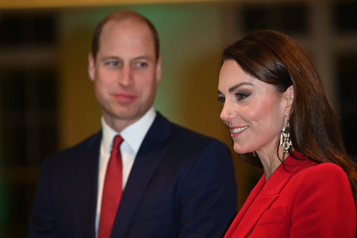 Kate Middleton, who said Prince William's not getting her red roses for Valentine's Day, walks with Prince William