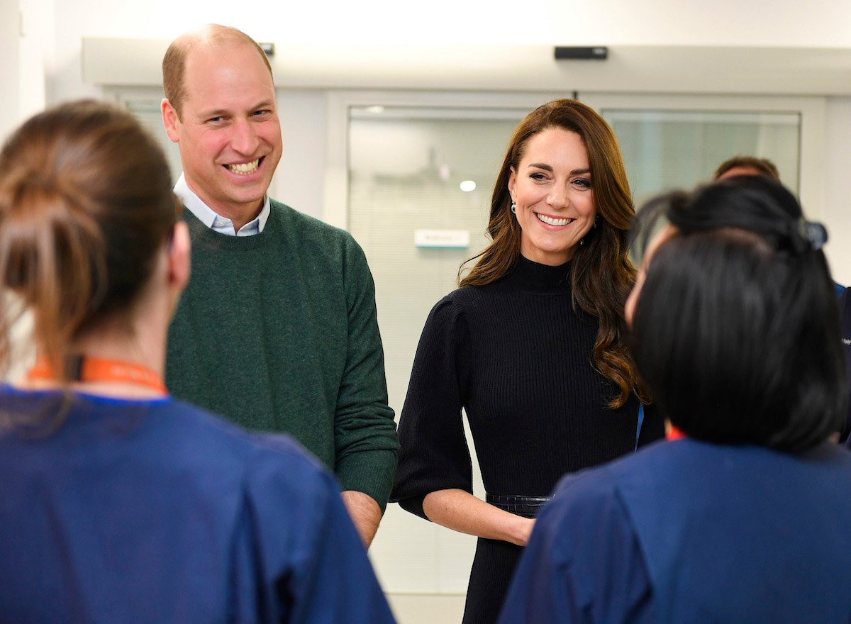 Prince William and Kate Middleton, who didn't recognize Kate Middleton's birthday on Jan. 9 publicly in what some commentators called a 'comment without a comment,' smile during a Jan. 12 visit to a hospital