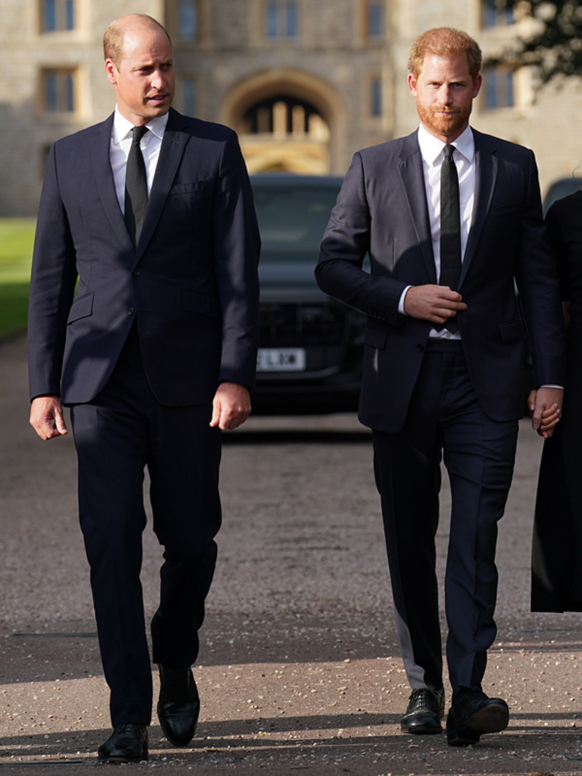 Prince William and Prince Harry walk together to meet members of the public on the long Walk at Windsor Castle