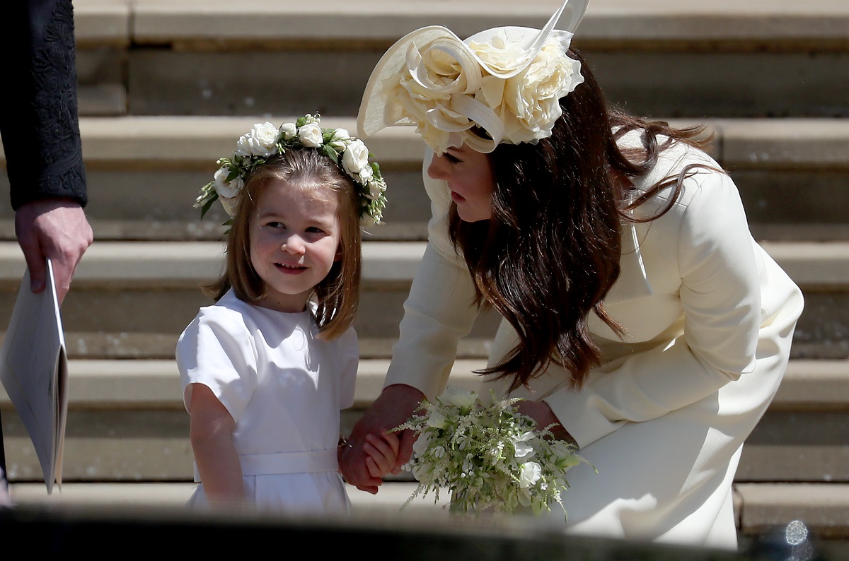 Kate Middleton with Princess Charlotte in her bridesmaid dress outside St George's Chapel after Prince Harry and Meghan Markle's wedding