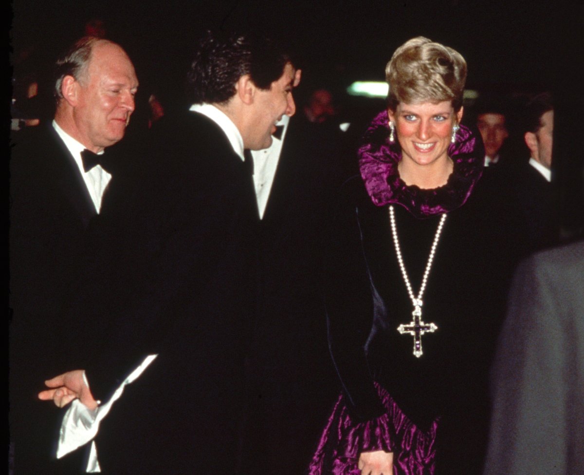 Princess Diana Arriving At A Charity Gala Evening On Behalf Of Birthright At Garrard. The Princess Is Wearing A Purple Evening Dress With A Gold And Amethyst Crucifix Suspended On A Pearl Rope