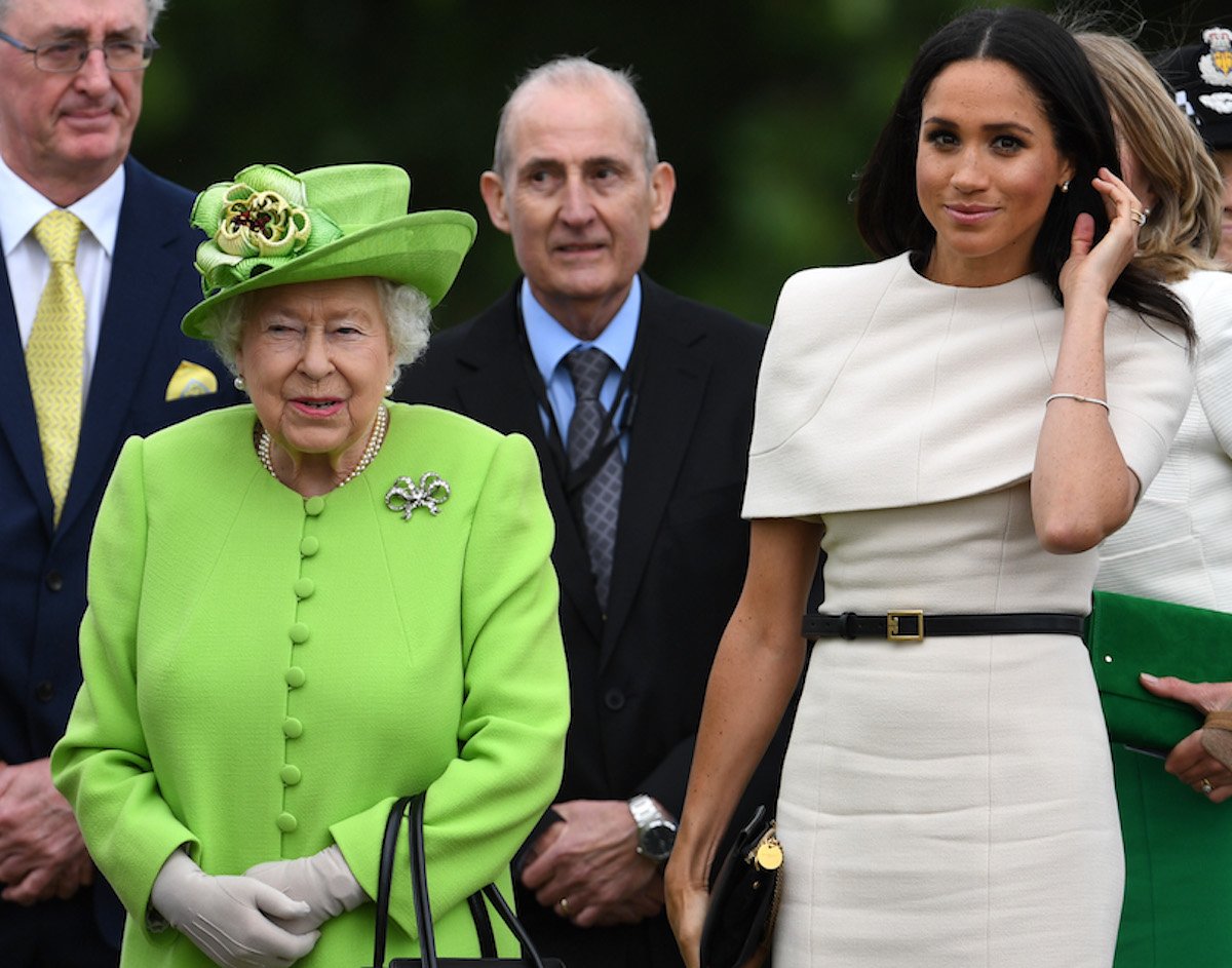 Queen Elizabeth II and Meghan Markle, who had the 'astonishing expectation' of seeing Queen Elizabeth at Balmoral Castle on the day she died, according to an author, attend a public engagement together in 2018