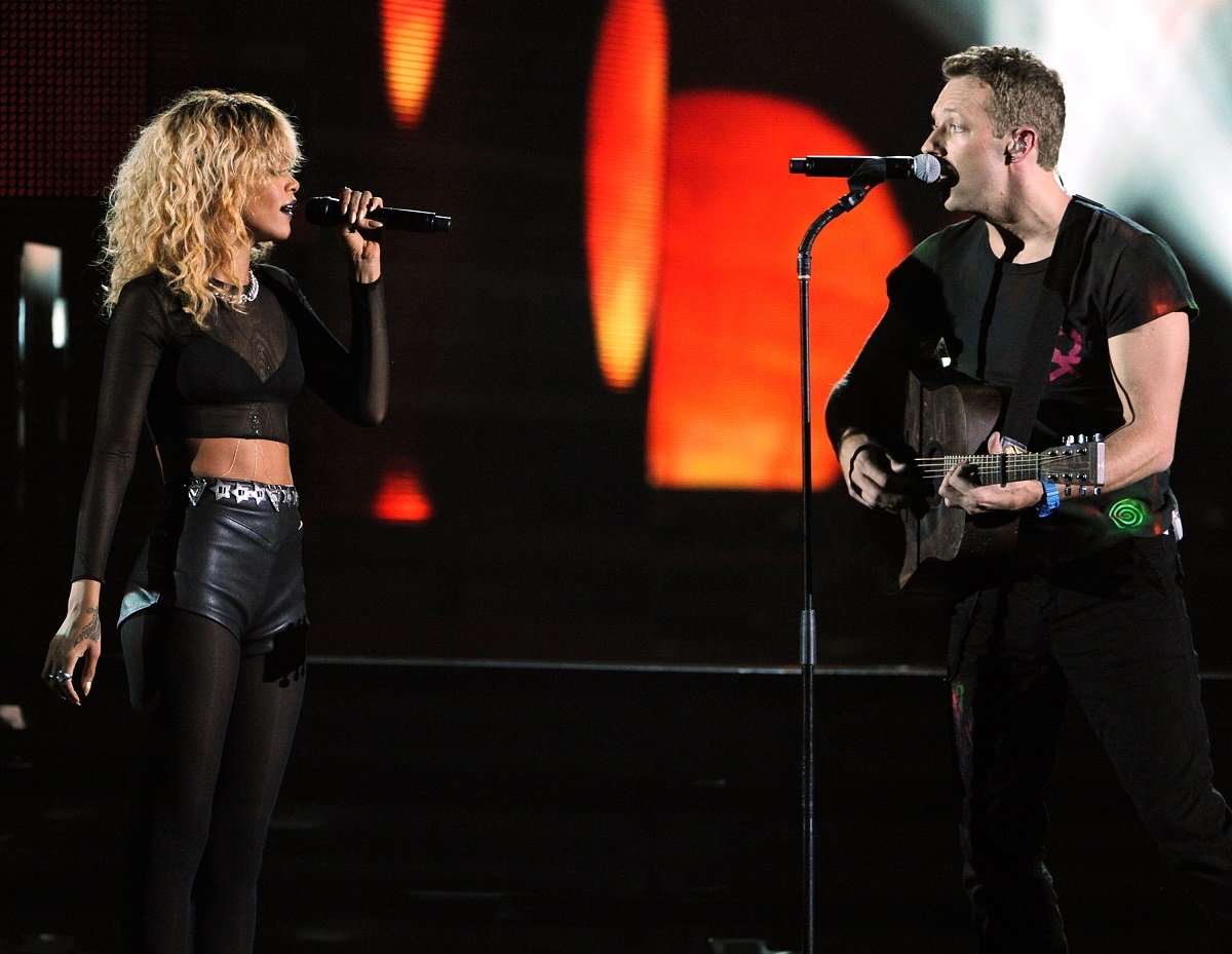 Rihanna and musician Chris Martin of Coldplay perform onstage together at the 54th Annual GRAMMY Awards