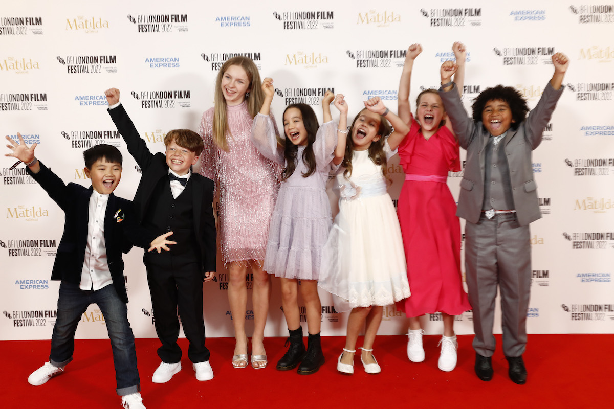 Andrei Shen, Charlie Hodson-Prior, Meesha Garbett, Rei Yamauchi Fulker, Alisha Weir, Winter Jarrett Glasspool, and Ashton Robertson cheer at the BFI London Film Festival as part of the Matilda The Musical cast