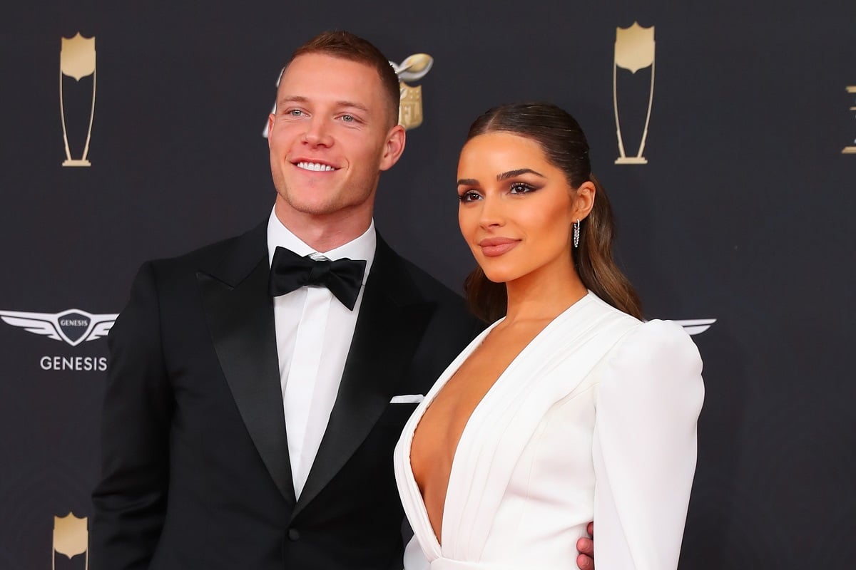 Running back Christian McCaffrey and Olivia Culpo, who is older than her beau, pose on the red carpet ahead of NFL Honors