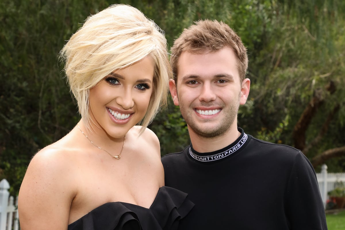 Savannah Chrisley and Chase Chrisley smile at the camera