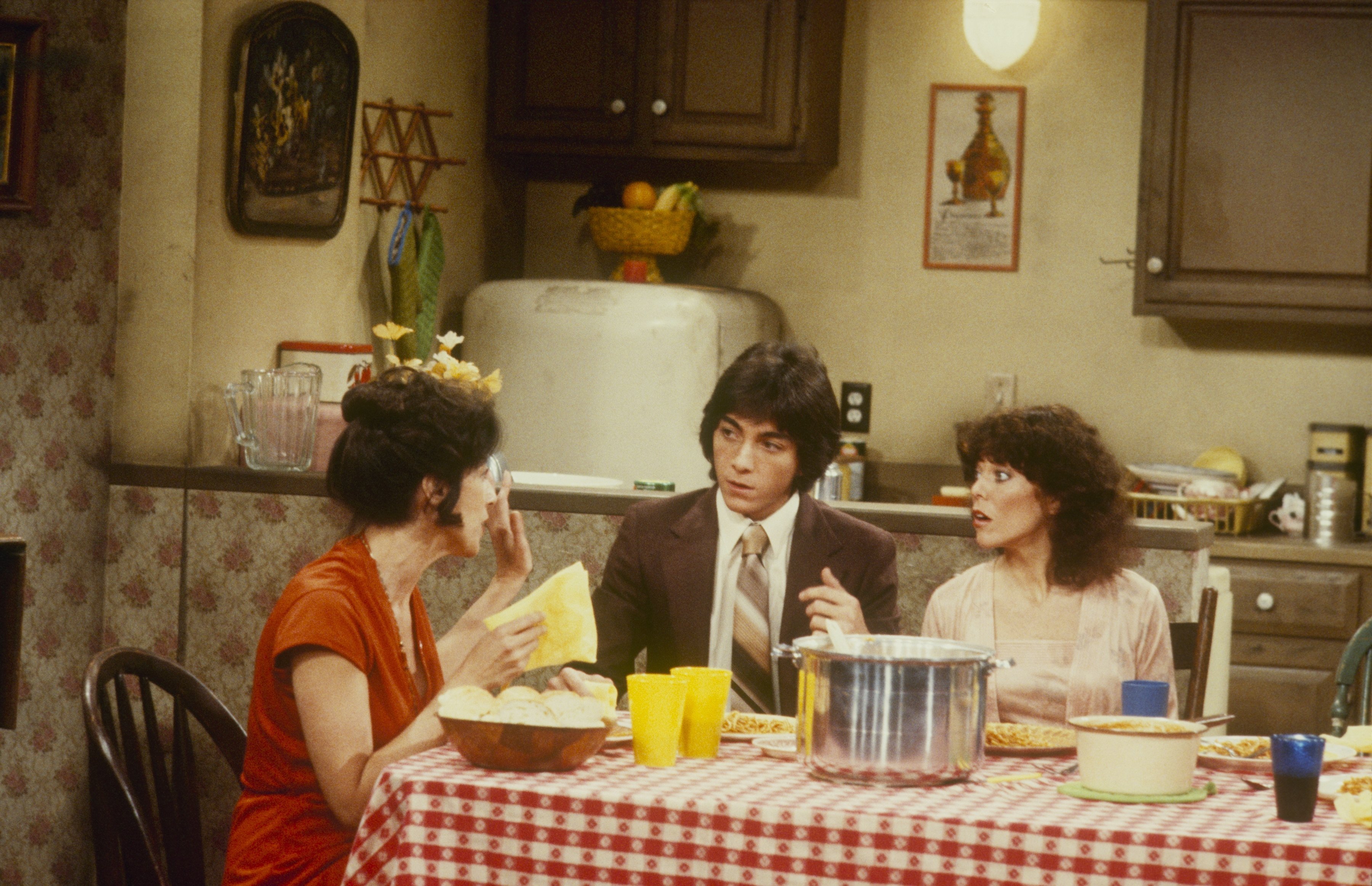 Scott Baio sitting at a table in an episode of 'Happy Days'