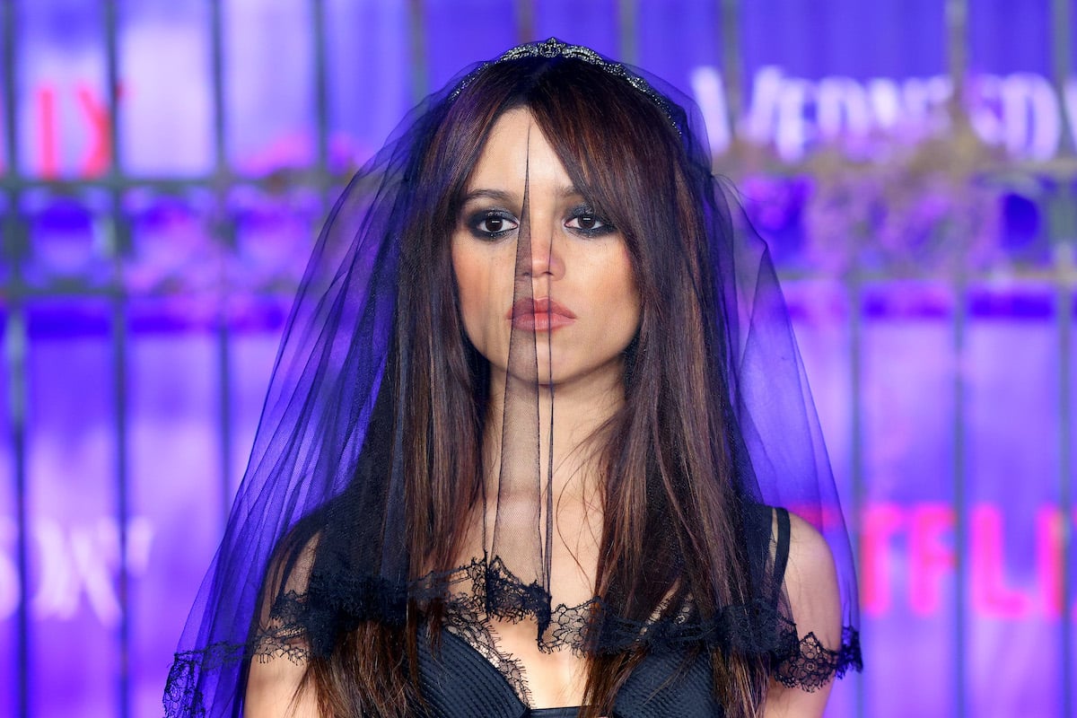 Scream star Jenna Ortega wears a black veil and dress