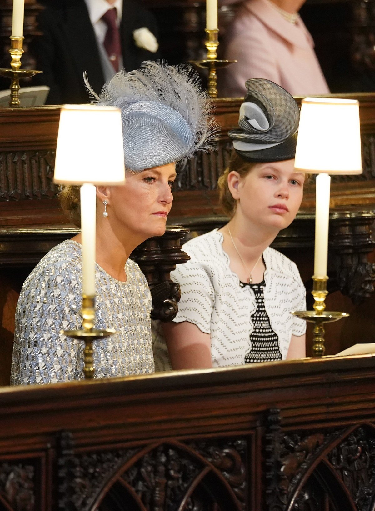 Sophie, Countess of Wessex and her daughter, Lady Louise Windsor, seated inside St. George's Chapel for Prince Harry and Meghan Markle's wedding