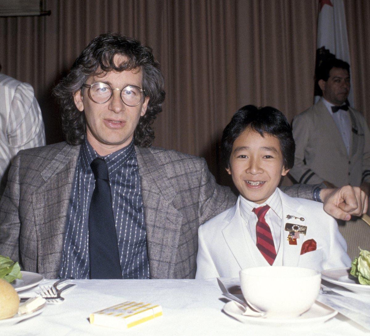 Indiana Jones' Steven Spielberg and Ke Huy Quan smile at a gala in 1985