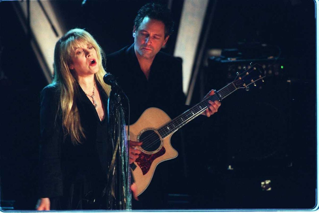 Stevie Nicks (left) and Lindsey Buckingham perform at Fleetwood Mac's Rock & Roll Hall of Fame induction ceremony in January 1998.