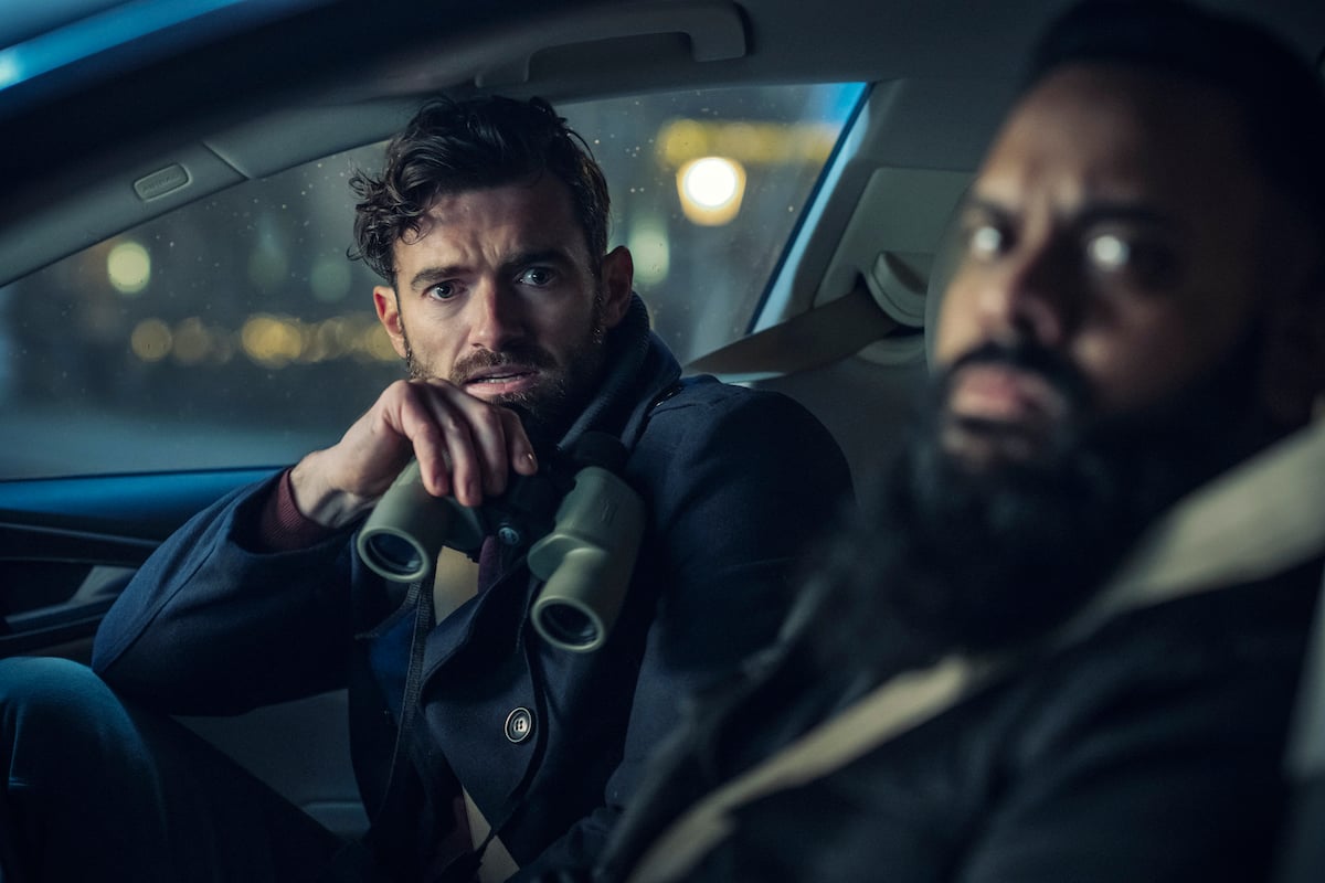 'Miss Scarlet and The Duke' actor Stuart Martin and Guz Khan sitting in a car in the Netflix movie 'Army of Thieves'